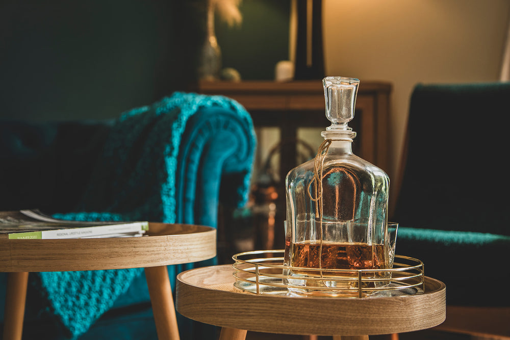 Luxury stay at Moonshine cottage Tumbarumba with velvet couch and whisky decanter